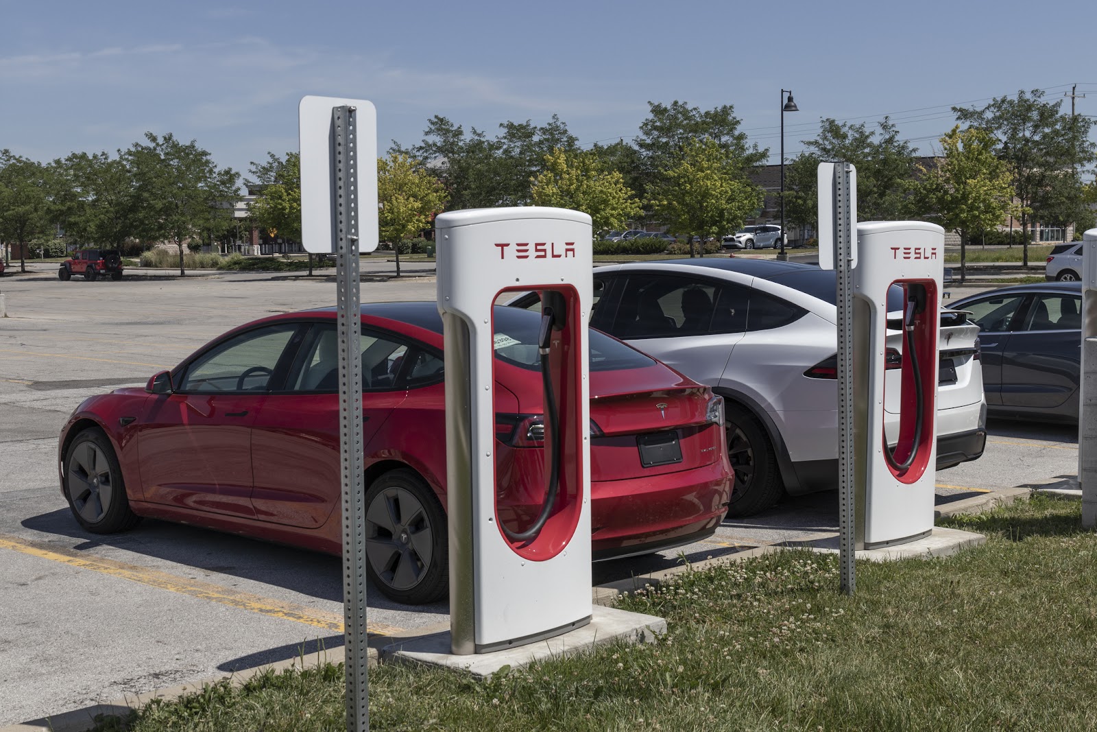 tesla model 3 at tesla charging station
