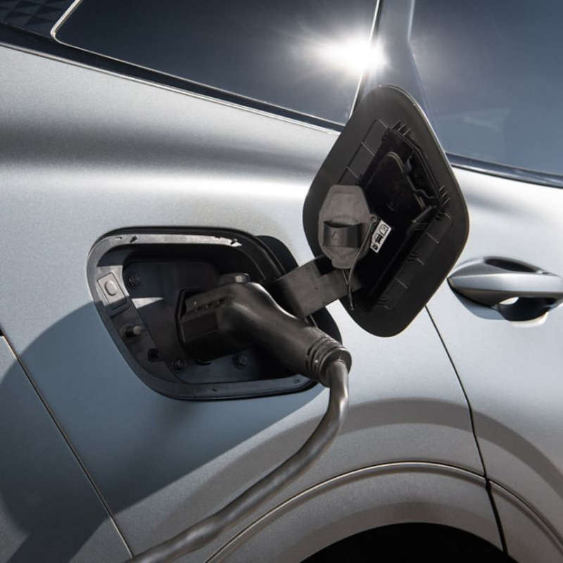 photo of 2025 Kia Sportage Plug-in Hybrid charging curbside